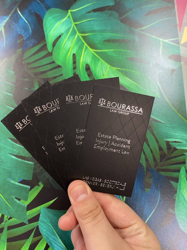 Glossy spot UV design on matte black business cards for law firm
