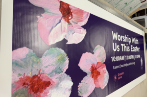 Easter-themed banner print with floral design and bold text